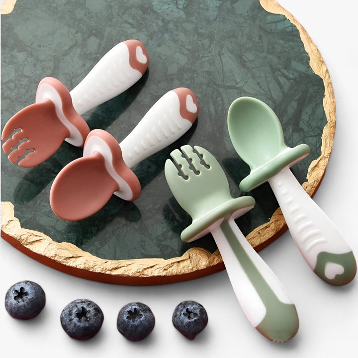Toddler silicone spoon & fork set for self-feeding. BPA-free baby cutlery in soft, safe silicone. Dishwasher safe feeding set.