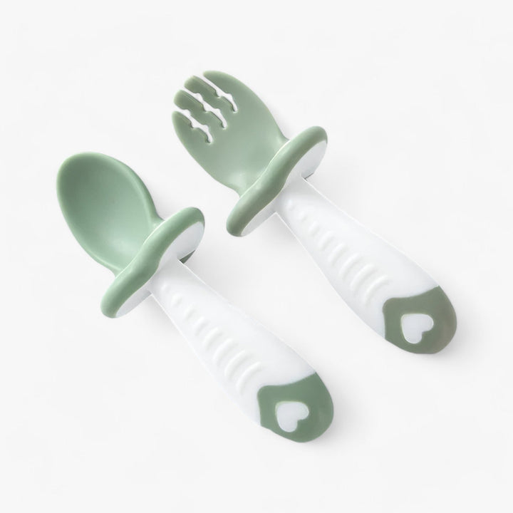 Soft silicone baby spoon & fork set, ideal for toddler self-feeding. BPA-free and dishwasher safe essentials for little ones.
