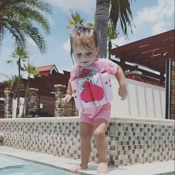 Toddler swim float vest, blue, with UPF 50 UV protection & built-in shorts for pool safety.