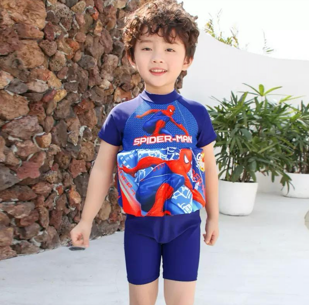 Kids' UPF 50 swim safety vest, pink, featuring integrated shorts for secure & fun pool time.