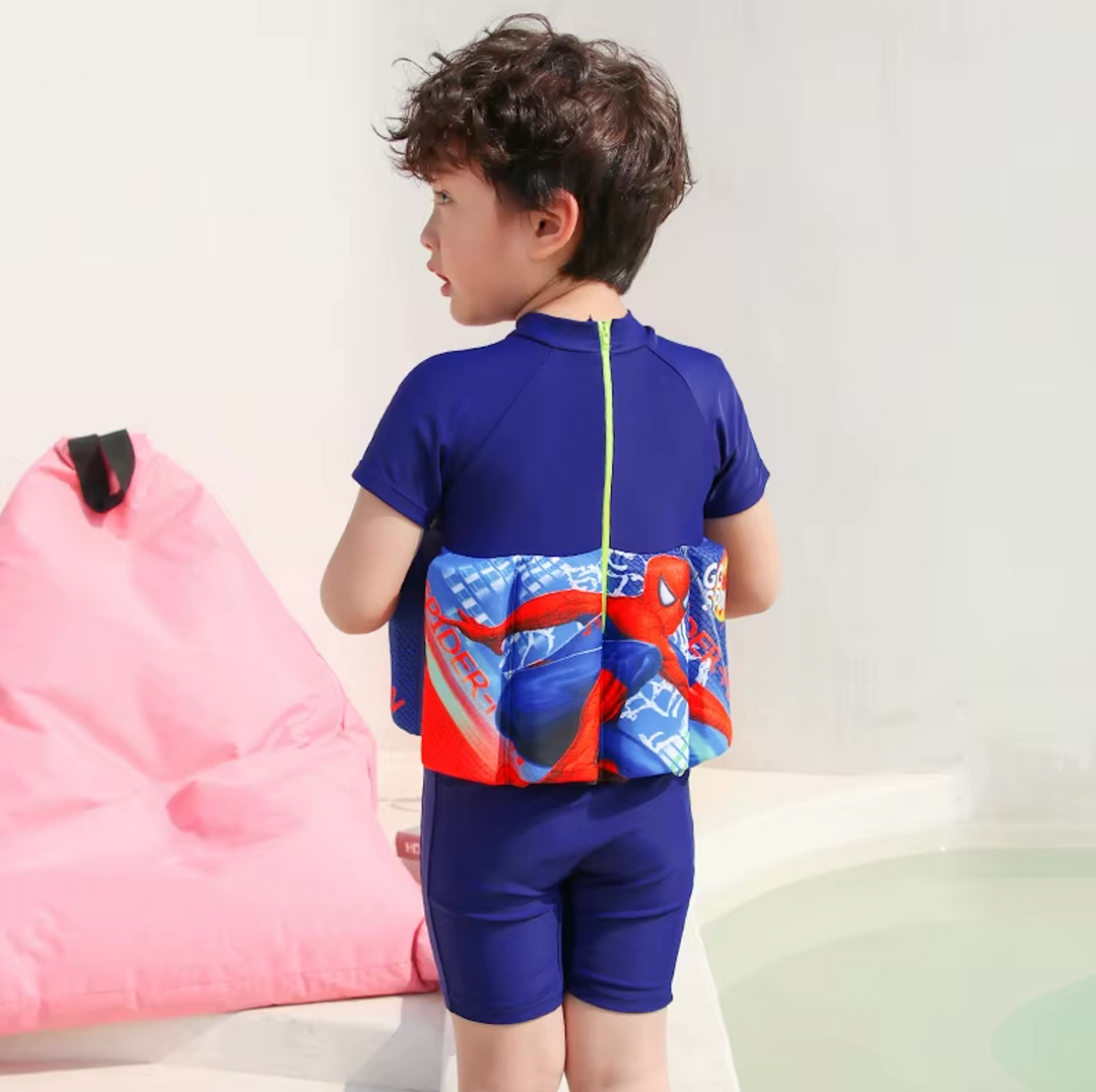 Green toddler beachwear float vest with integrated shorts, providing UPF 50 sun protection.