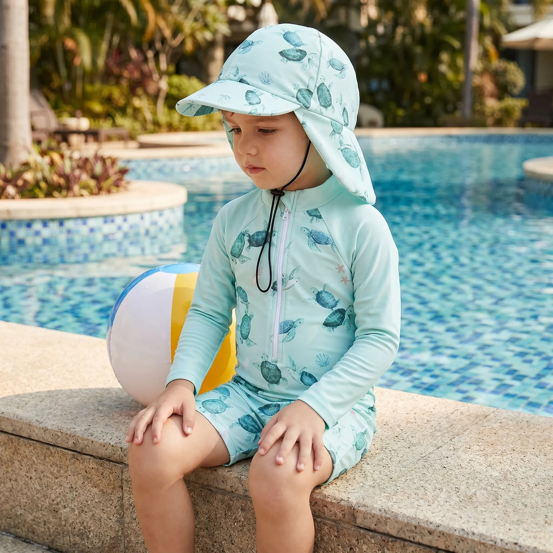 Toddler unisex long-sleeve swimsuit set with sun protection hat, perfect for summer pool and beach play.