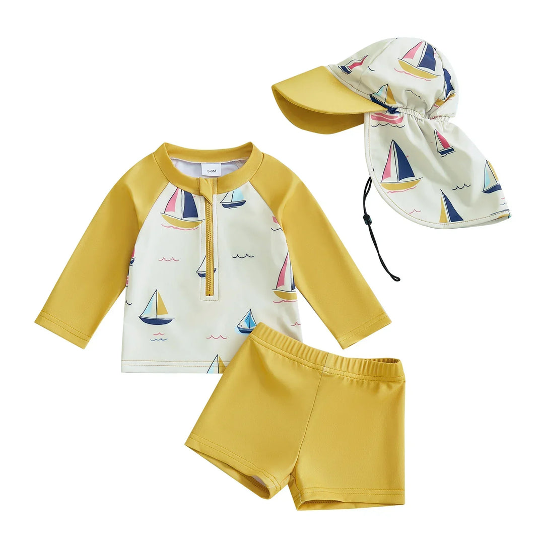 Stylish toddler unisex three-piece swim outfit, featuring a long-sleeve top, shorts, and hat for sun safety.