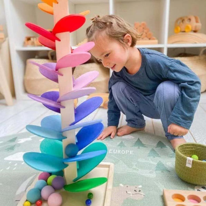 Kids' wooden sound tree marble run, vibrant leaves and natural wood for early development.