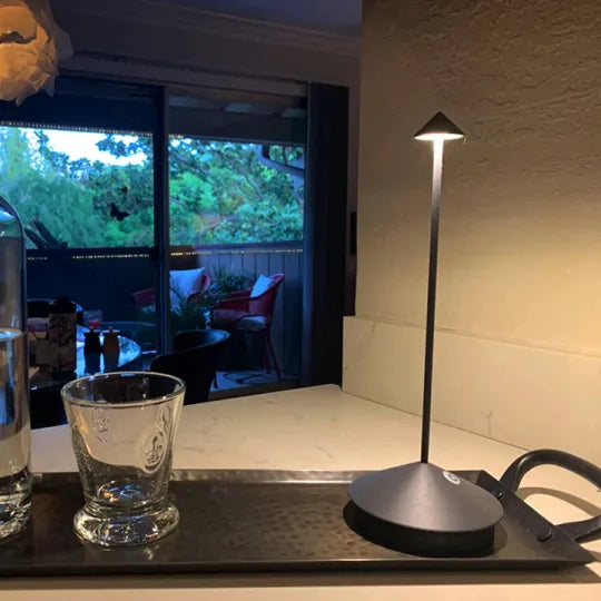 TranquilGlow dimmable LED lamp. Cordless, modern design for versatile indoor/outdoor lighting.