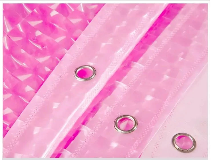 Translucent shower curtain showing a soft pink behind 3D cube pattern