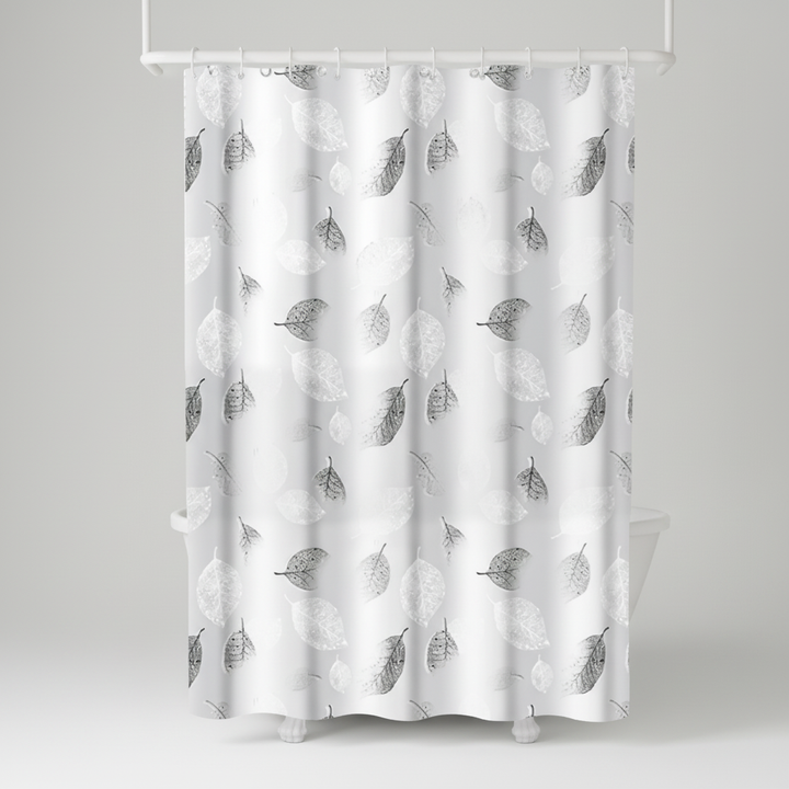 Transparent bathroom decor: AquaLeaf shower curtain with an intricate leaf motif and included hooks.