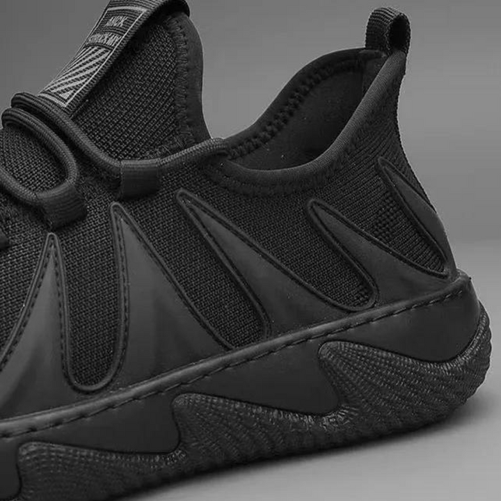 Stylish black men's breathable sneakers, lightweight and versatile for trendy casual & activewear outfits.