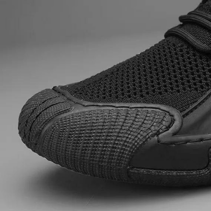 Men's trendy black lightweight sneakers with breathable mesh upper, perfect for all-day comfort & style.