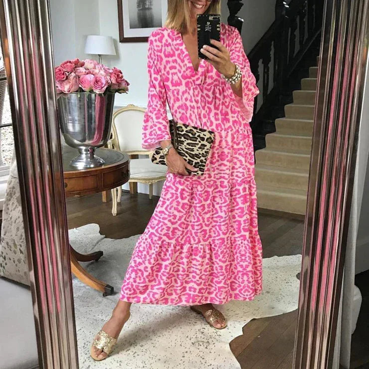 Trendy pink leopard print women's maxi dress with V-neck and bell sleeves. Elegant summer fashion for any occasion.