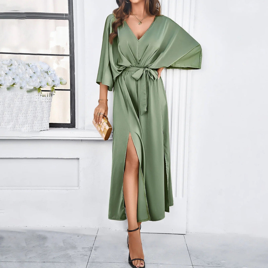 Stylish women's midi V-neck dress, ideal for spring & summer. Versatile, trendy, and comfortable fashion.