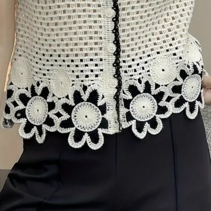 Stylish women's white openwork blouse with delicate lace details, offering comfort and trendy appeal for spring/summer.