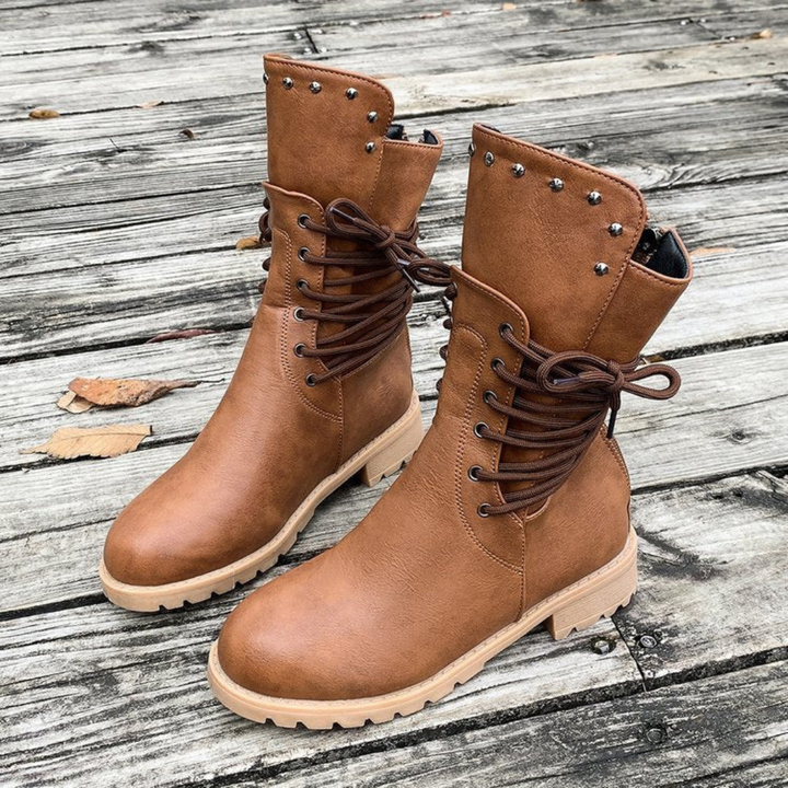 Trendy women's black walking boots, comfortable for everyday wear. Versatile ankle footwear for modern casual style.