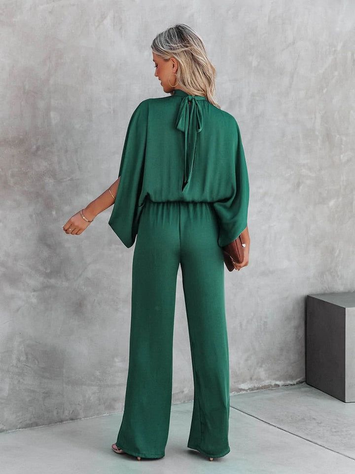 Fashionable green women's jumpsuit, a trendy one-piece outfit. Ideal for party wear or a stylish casual look.