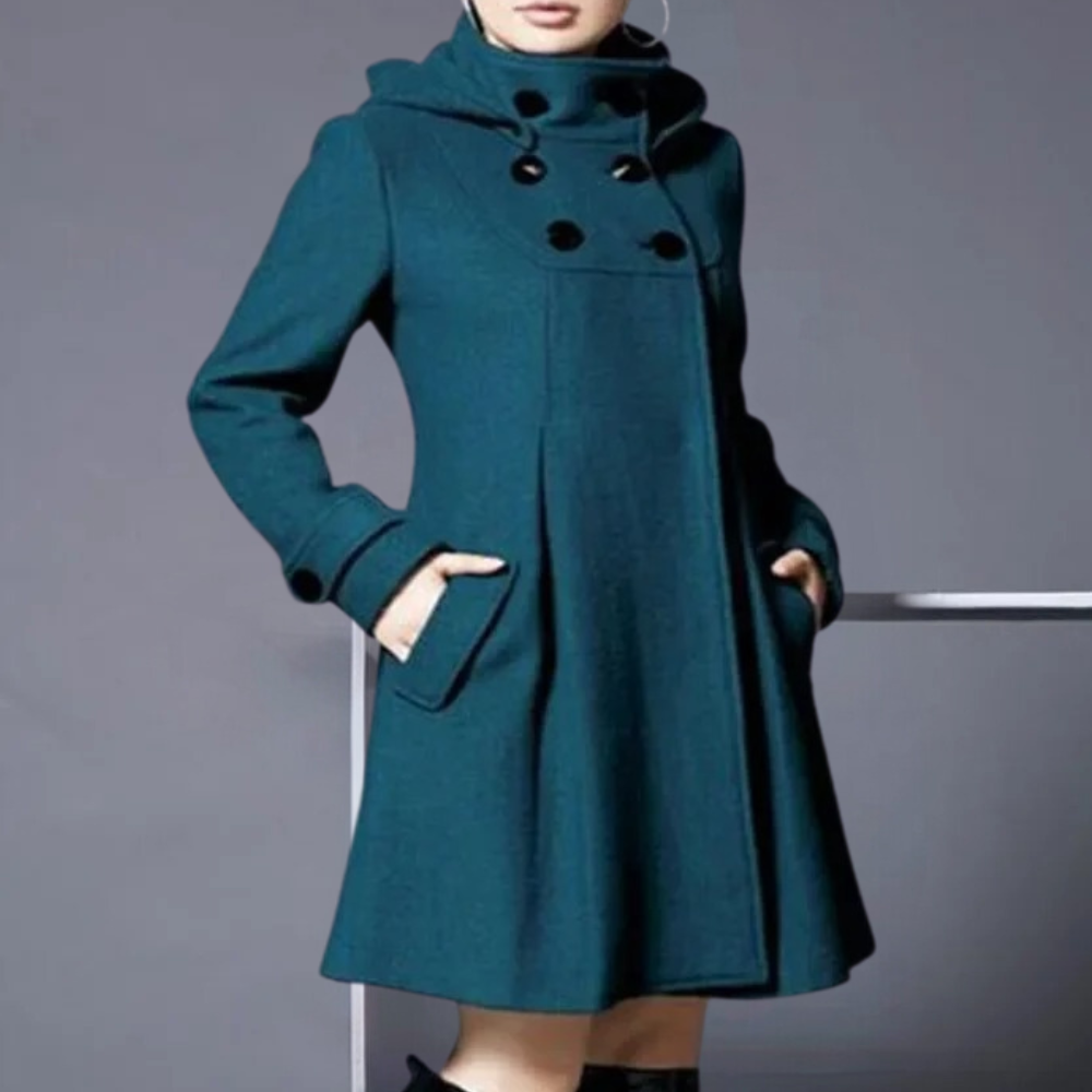 Stylish dark green women's jacket, the Medila, featuring practical side pockets. Elegant fall/winter outerwear.
