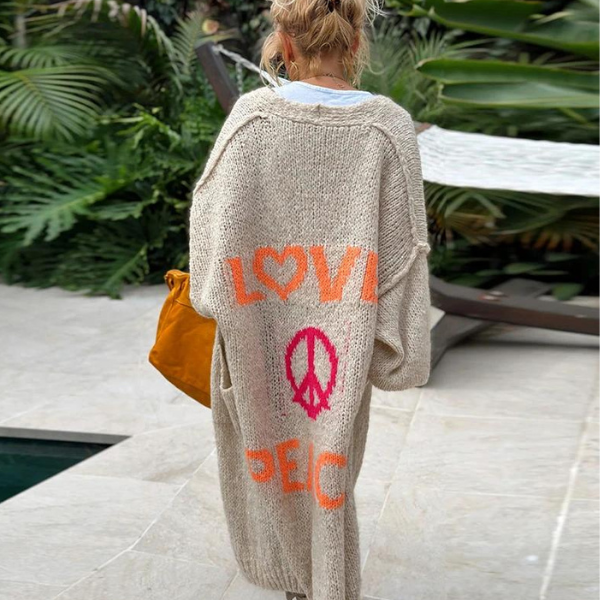 Women's stylish long knitted cardigan, a trendy and cozy fashion staple.