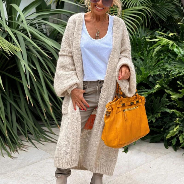 Trendy women's long knitted cardigan, versatile fashion outerwear for casual comfort.