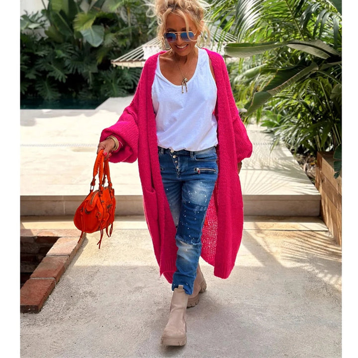 Cozy long knitted cardigan for women, a trendy and comfortable outerwear piece.