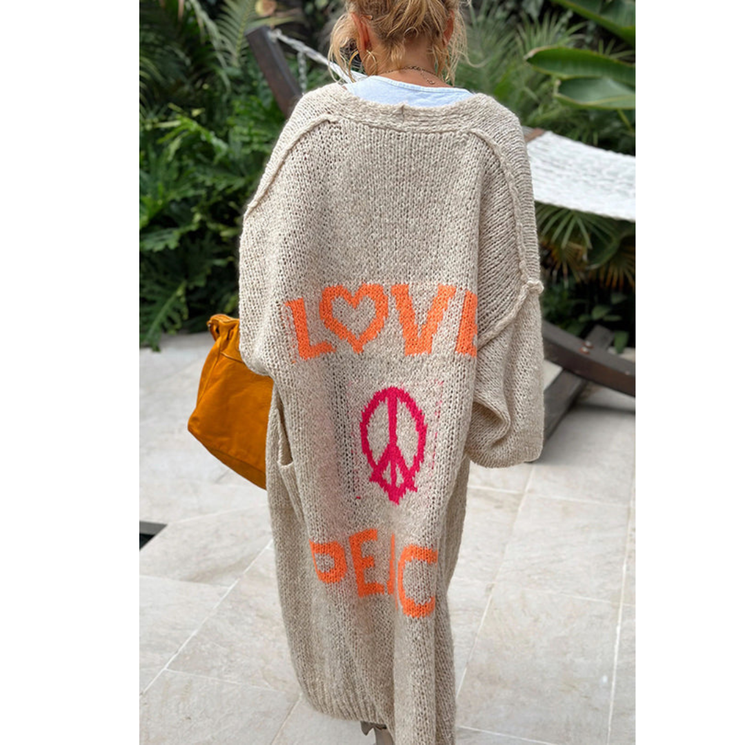 Chic women's long knitted cardigan, offering a trendy and comfortable layering style.