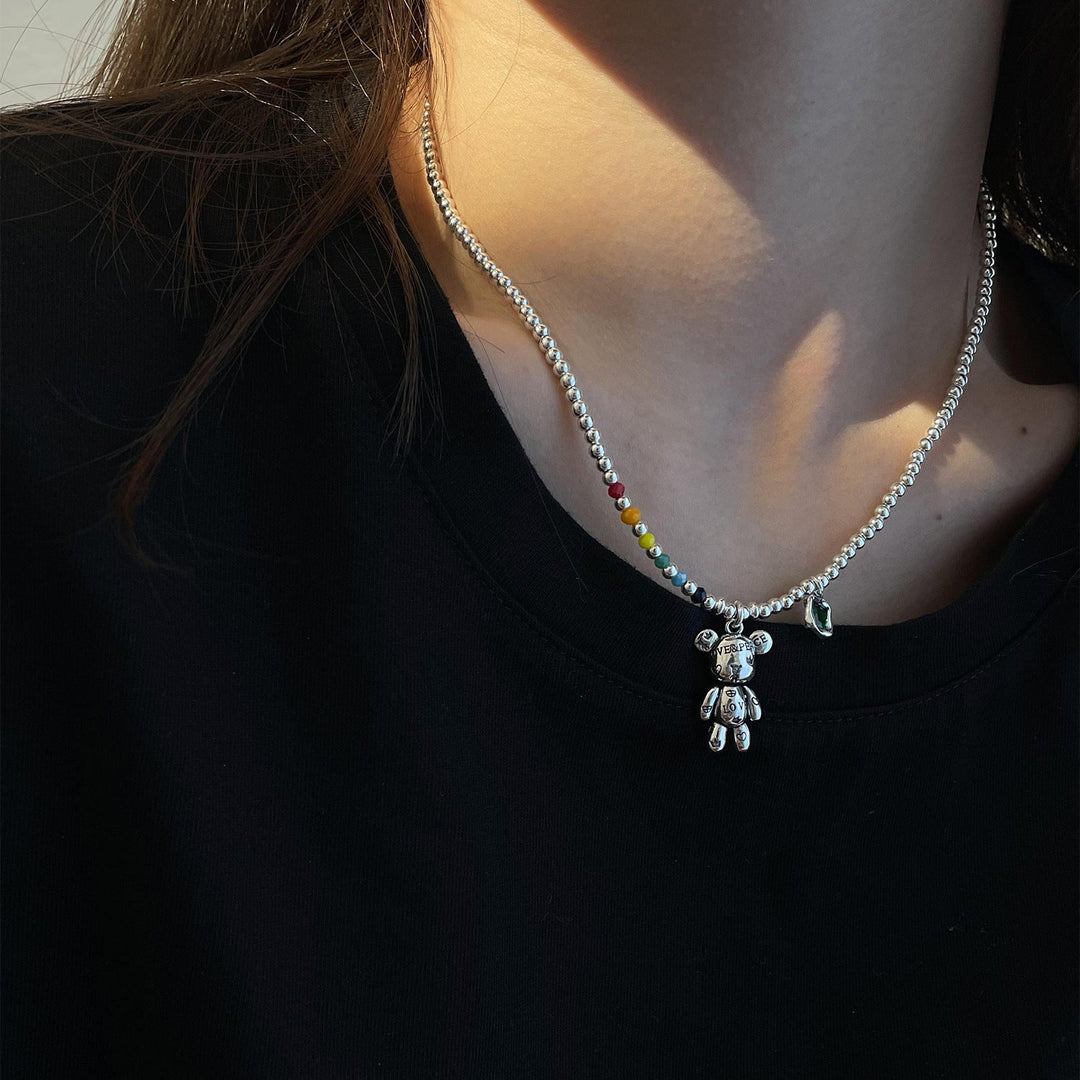 Fashionable women's trendy necklace made of stainless steel, adorned with a captivating white gemstone. Stylish accessory.