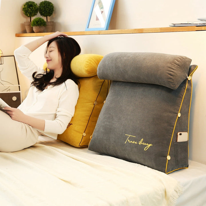 Triangular back support pillow for ergonomic comfort, ideal for relaxation & home use.
