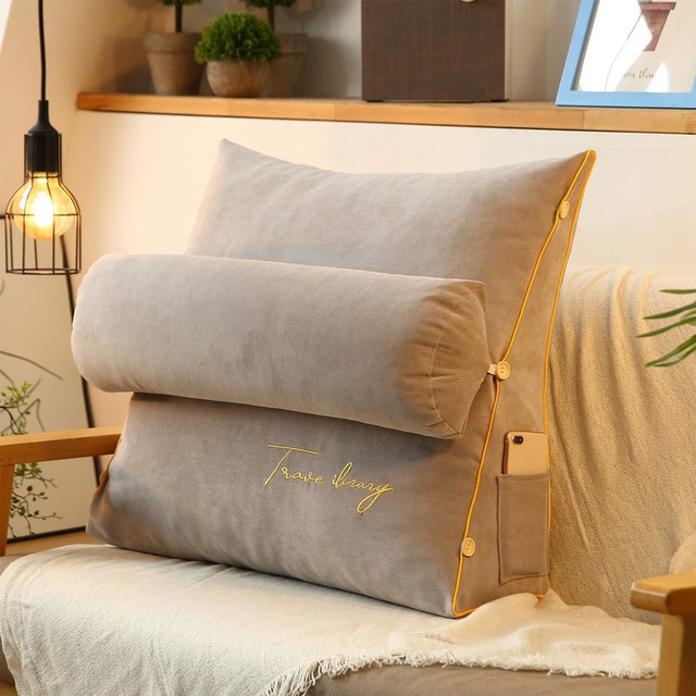 Triangular ergonomic pillow for superior back support, ideal for lounging & bed rest.