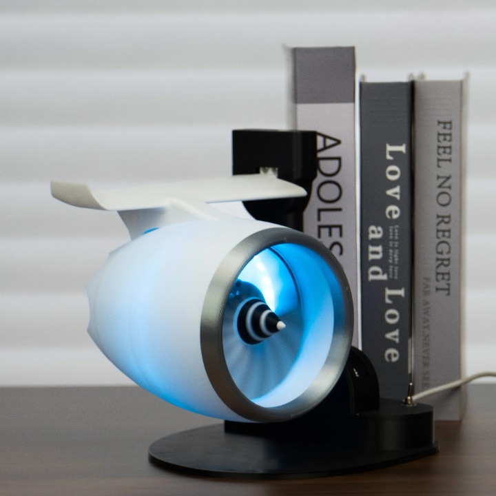 Office desk with AeroMist turbojet fan humidifier, improving air with mist and light