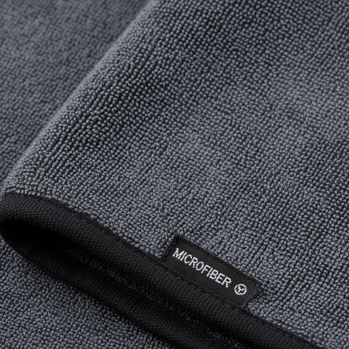 Highly absorbent DryMaxPro microfiber cloth, ideal for car drying and household tasks, leaving no streaks.