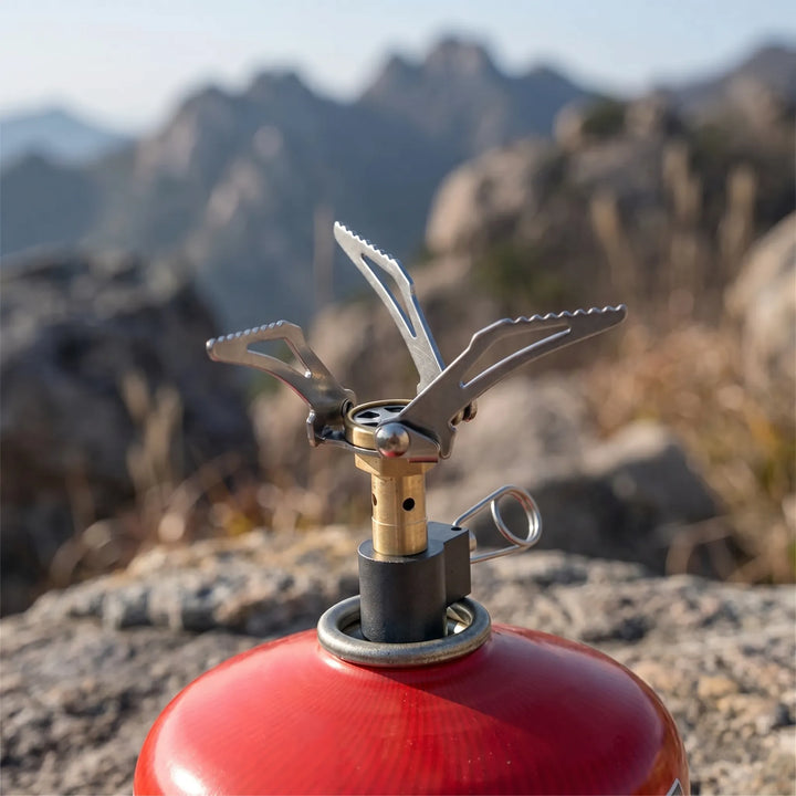 Ultra-compact portable gas burner for backpacking & travel. Lightweight camping stove for outdoor cooking.
