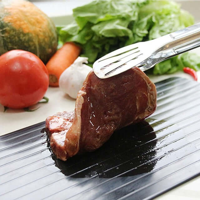 Safe, natural aluminum defrosting tray. Rapidly thaws frozen foods, meats & fish without electricity or water.