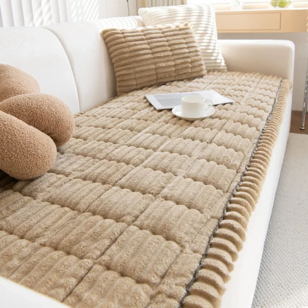 Ultra plush sofa slipcover for cozy comfort. Protects furniture, adds warmth to your living room decor.
