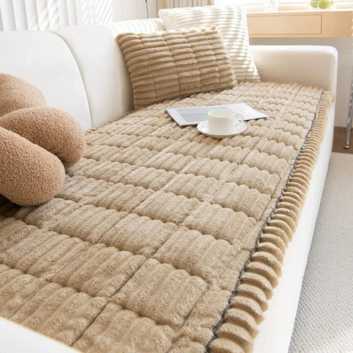 Ultra plush sofa slipcover for cozy comfort. Protects furniture, adds warmth to your living room decor.