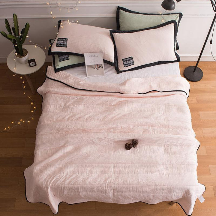 CoolBreeze lightweight bamboo & cotton blend cooling blanket for comfortable, breathable summer sleep.