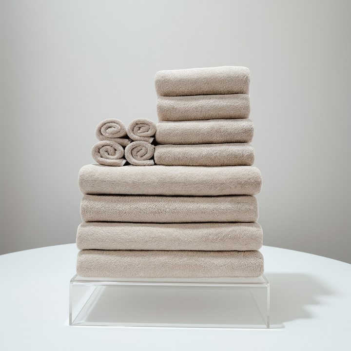 Stack of quick-dry coral fleece towels in various colors, perfect for a modern bathroom