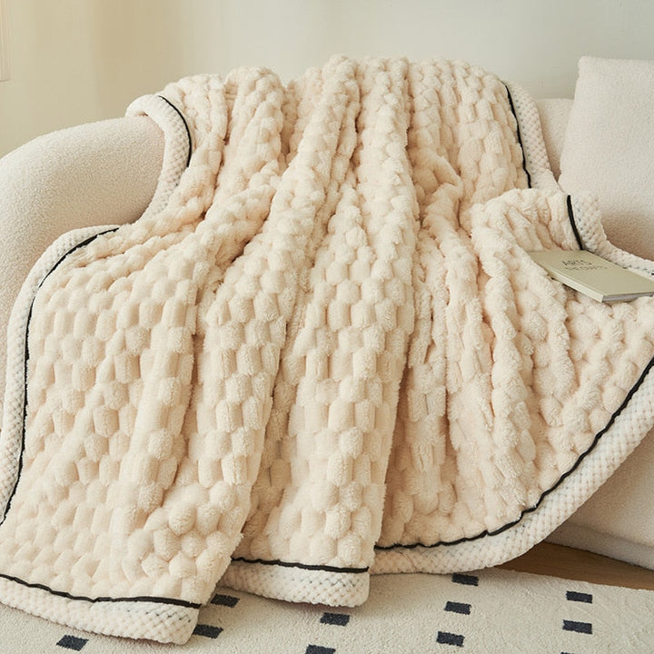 Close-up of a cozy, soft flannel fleece throw blanket, highlighting its plush texture for ultimate comfort.
