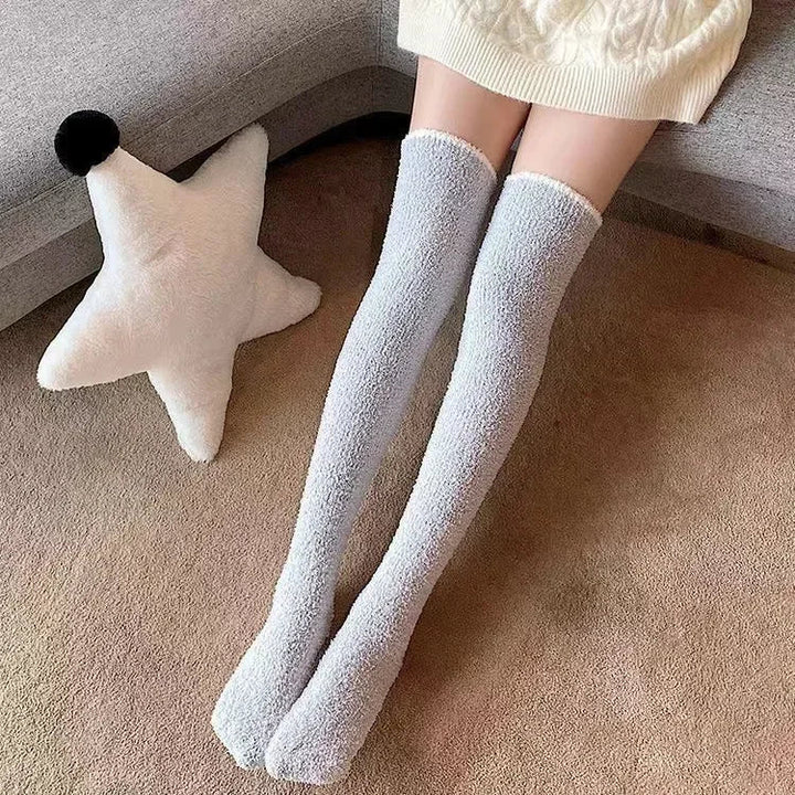 Women's ultra-soft fuzzy knee high socks in a neutral color, providing cozy warmth & comfort.