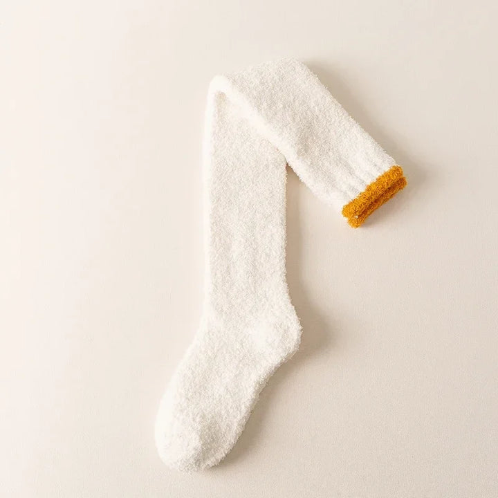 Plush, fuzzy women's knee high socks, offering extreme softness and comfort for cold days.