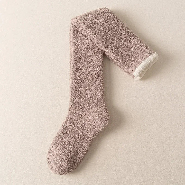 Warm women's fuzzy knee high socks, ideal for cozy evenings & winter comfort.