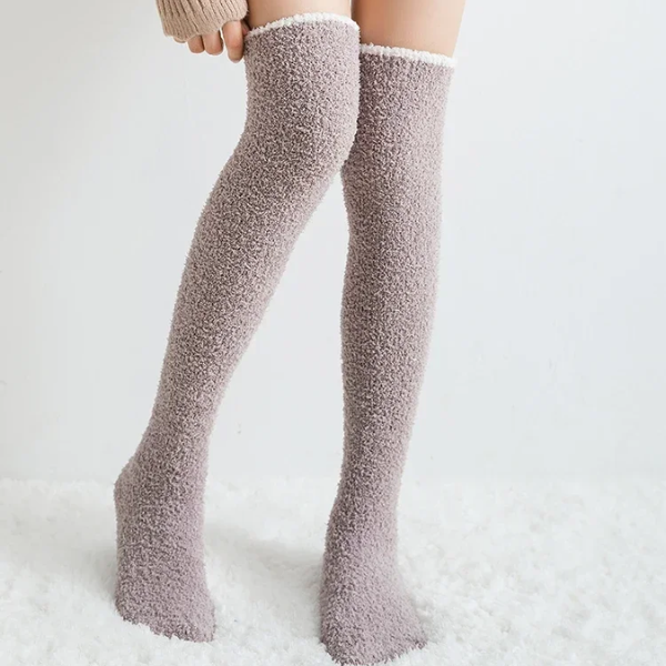 Cozy fuzzy knee high socks, essential for women's fall fashion and winter warmth.