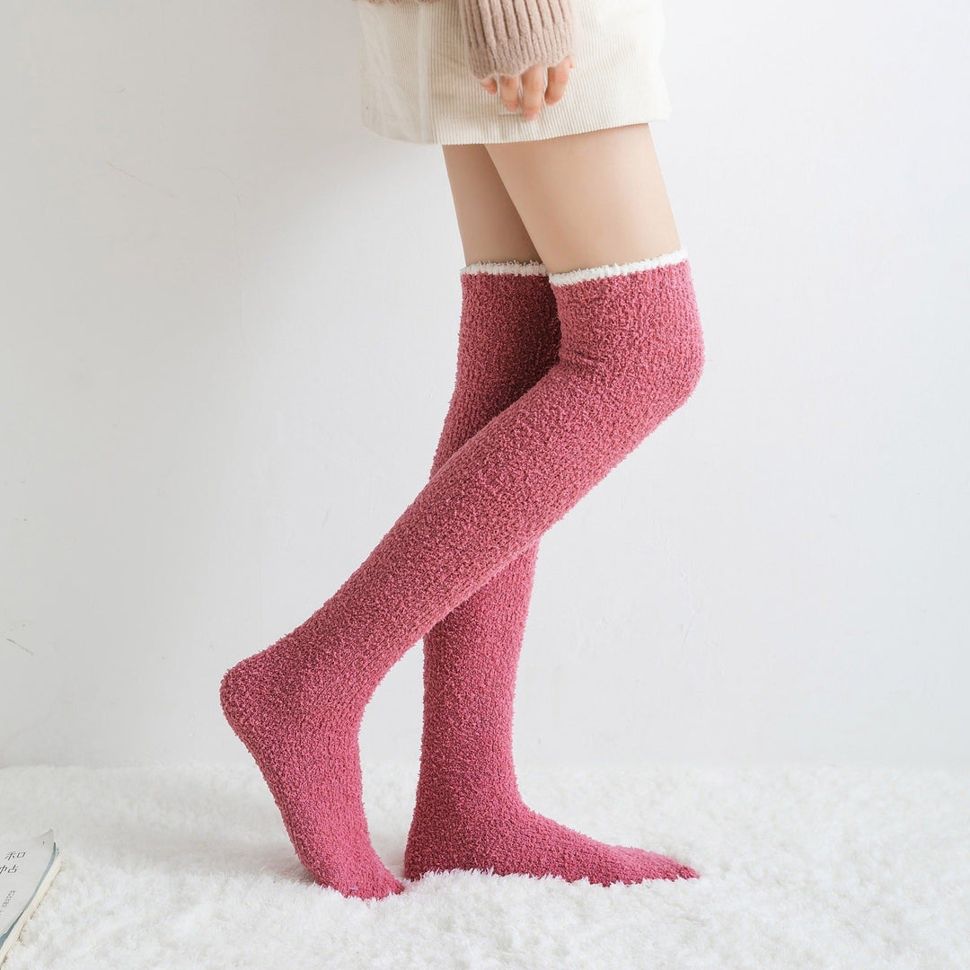 Close-up of the ultra-soft texture of fuzzy knee high women's socks in a cozy setting.