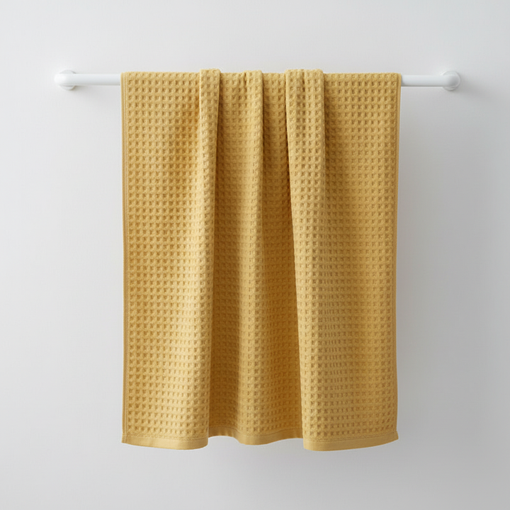 Full view of a single Pima cotton waffle towel, highlighting its generous size and premium, ultra-soft texture