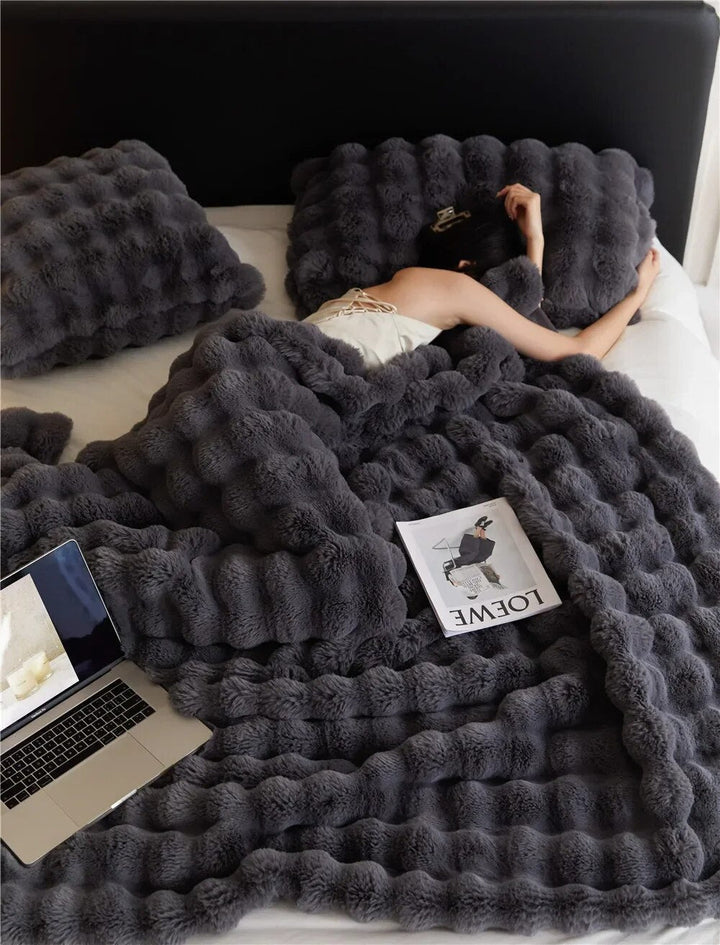 Luxurious unisex plush fleece blanket for ultimate cozy comfort. Ideal soft throw for any home setting.