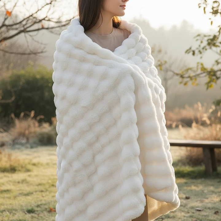 Ultra-soft plush throw blanket in a cozy living room setting, perfect for home decor and warmth.