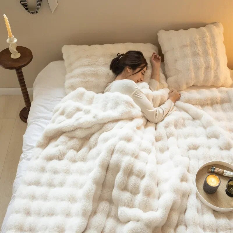 Unisex plush throw blanket draped over an armchair, offering warmth and enhancing home decor.