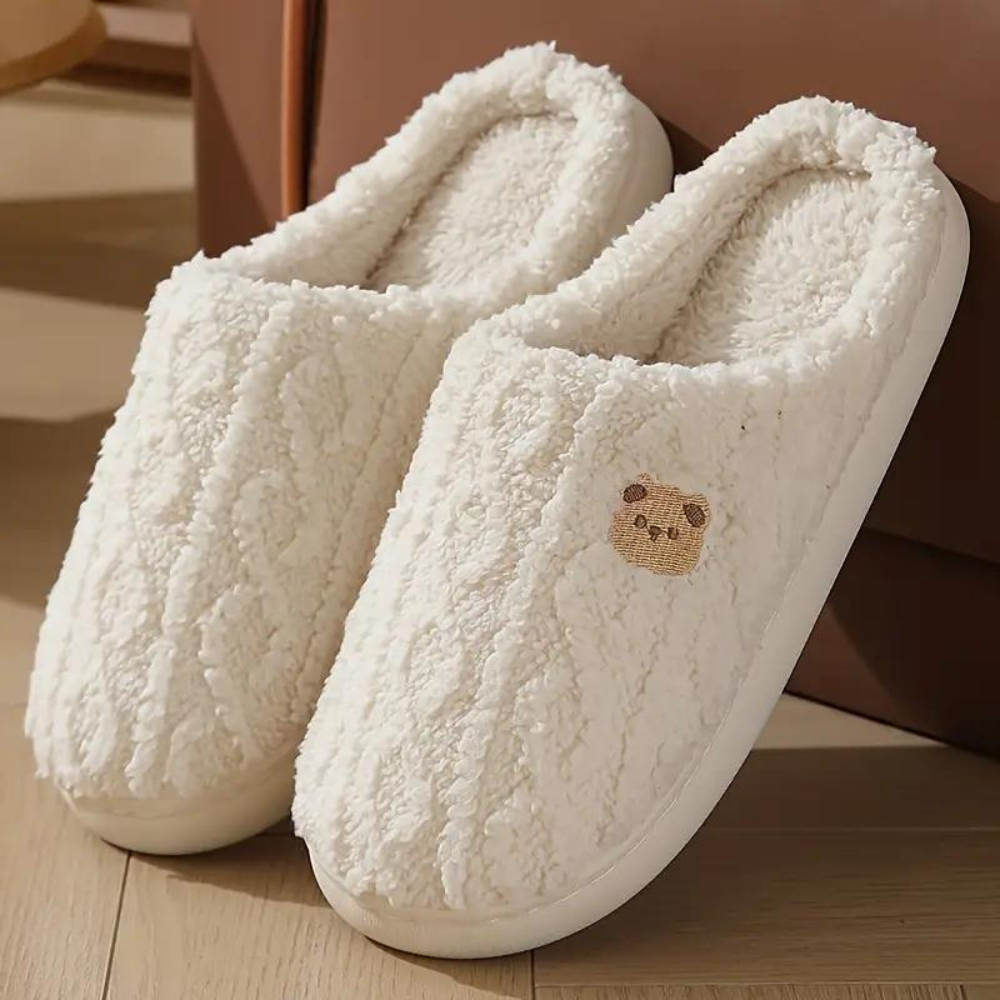 Ultra-soft plush women's house slippers for ultimate comfort & warmth. Cozy indoor footwear for relaxing at home.