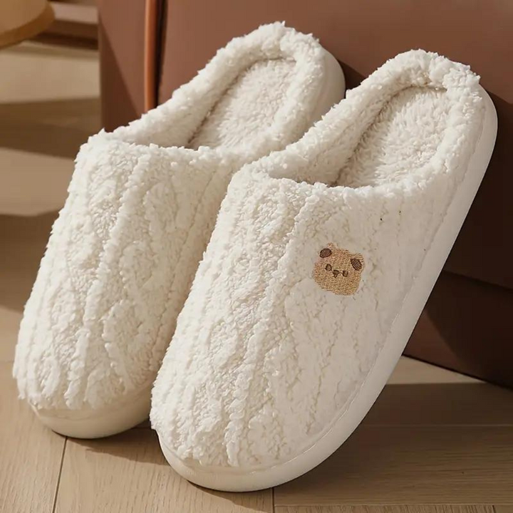 Ultra-soft plush women's house slippers for ultimate comfort & warmth. Cozy indoor footwear for relaxing at home.