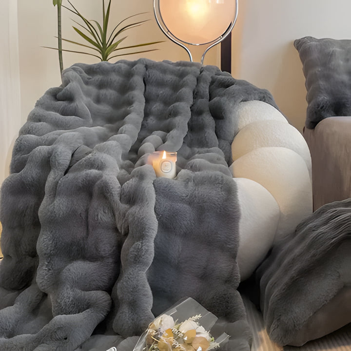Luxurious unisex faux fur throw blanket for ultimate comfort, a soft addition to any living room or bedroom.