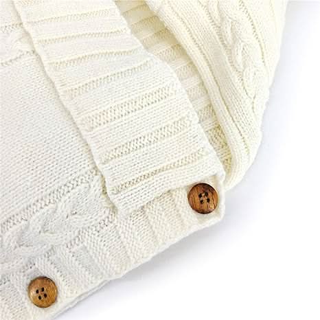 Soft beige infant blanket & travel swaddle wrap. Ultra-cozy comfort for baby essentials, suitable for 0-6 months.