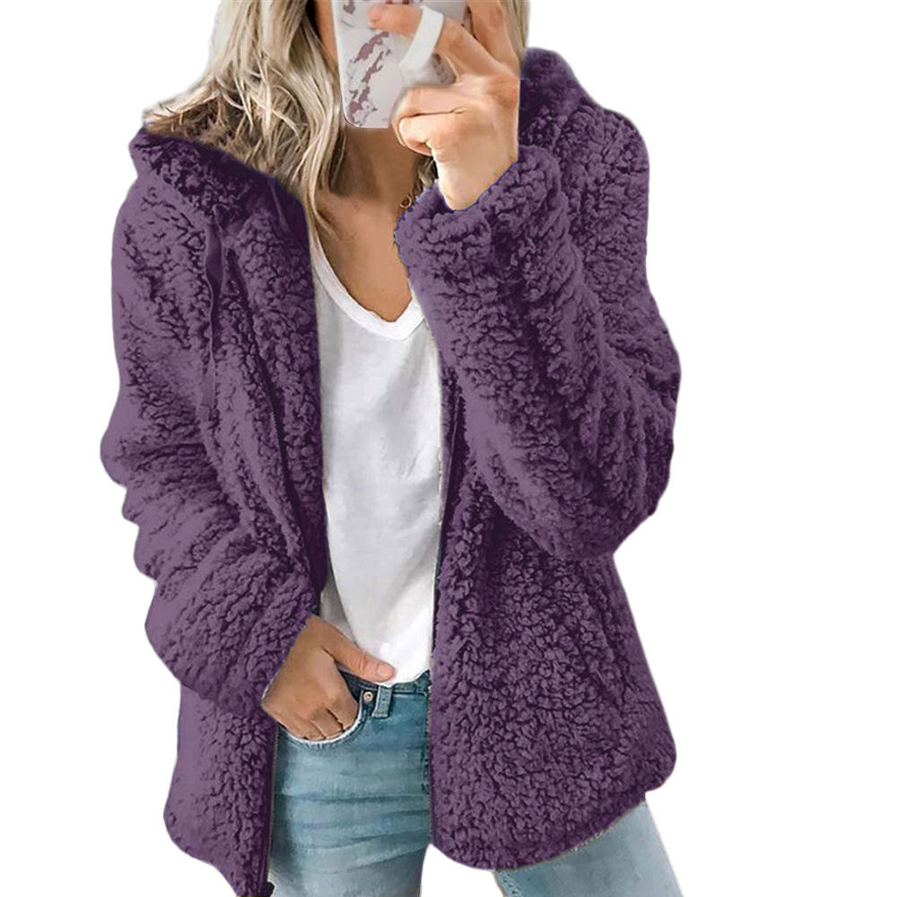 Warm women's teddy coat, a stylish zip-up outerwear piece with pockets for casual fashion.