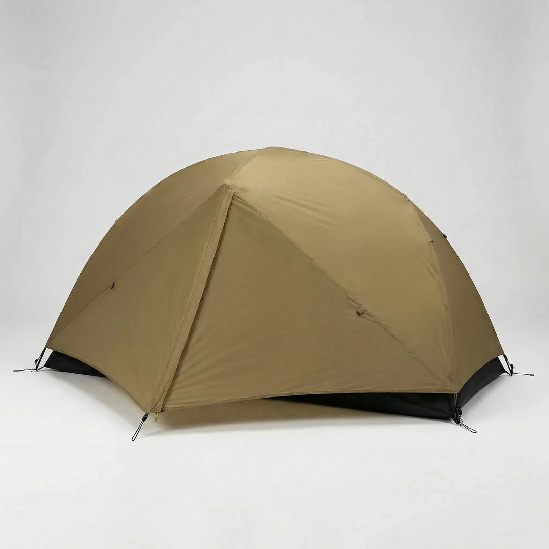 Packed ultralight 1-person tent beside a backpack, showing its compact size for easy solo hiking & camping transport.